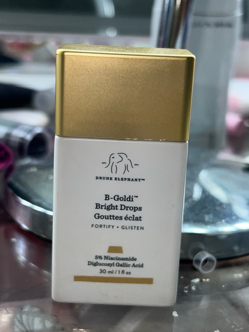 Drunk Elephant B-Goldi Bright Drops – Gold and White Bottle